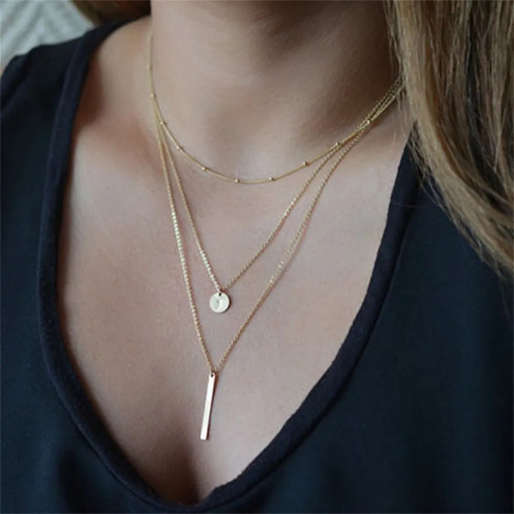 Collier triple breloques or