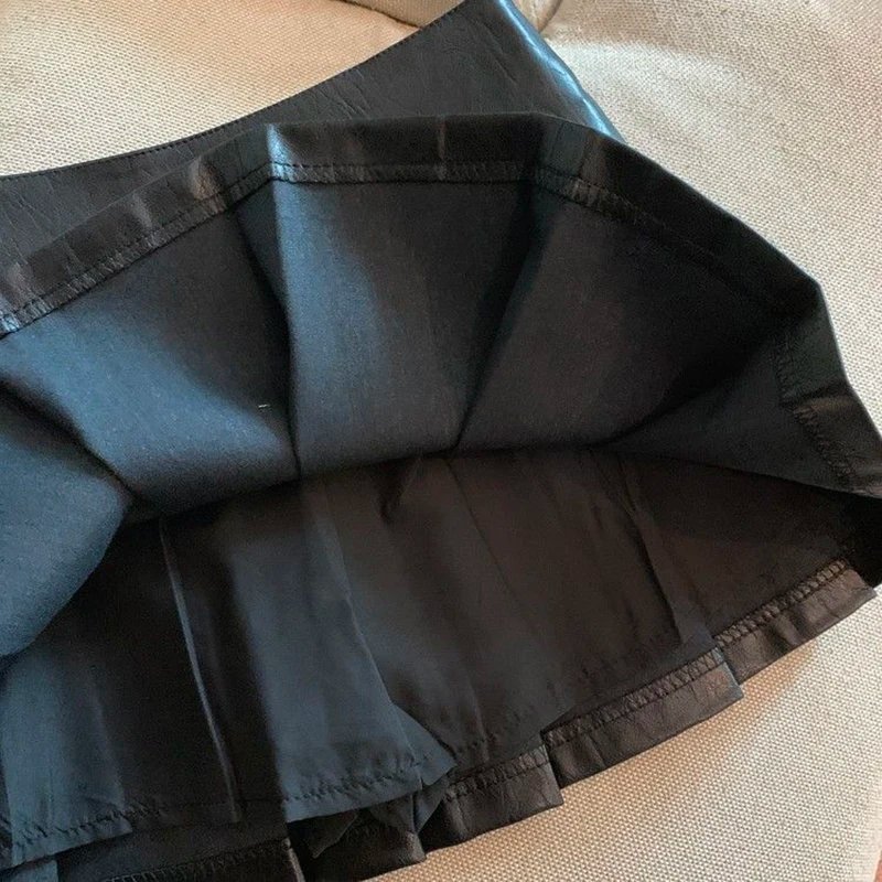 Jupe plissé effet cuir taille haute